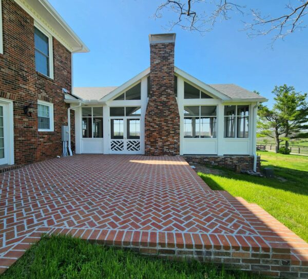 Stamping Ground exterior view of screen porch with brick patio
